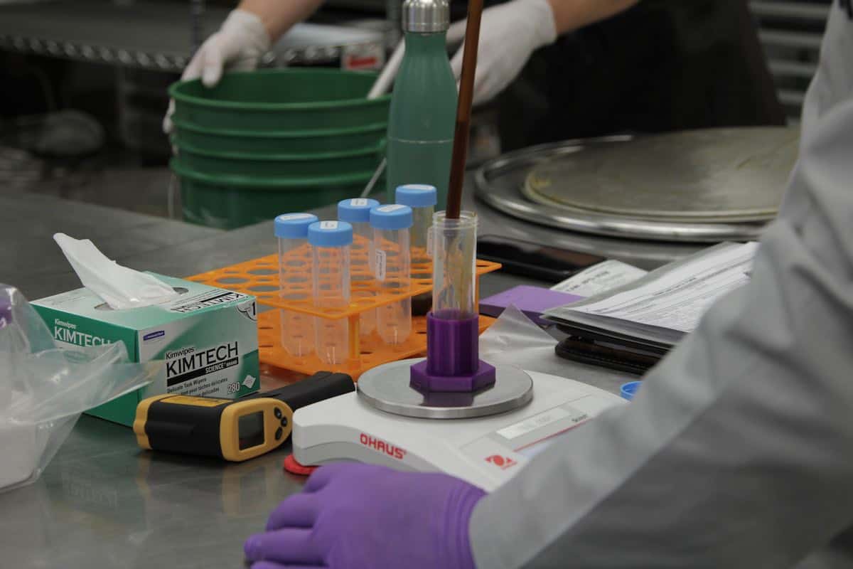 A lab technician takes samples at the Danodan facility during our production process