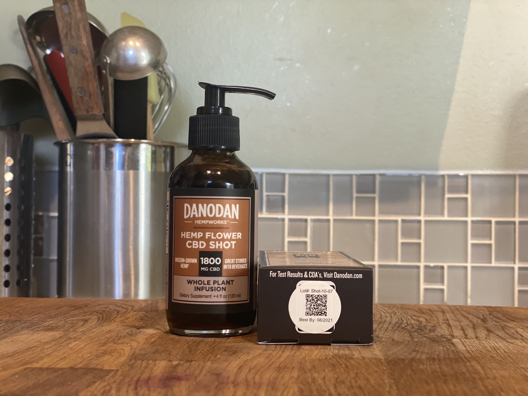A bottle of Danodan and a Danodan box showing a QR code