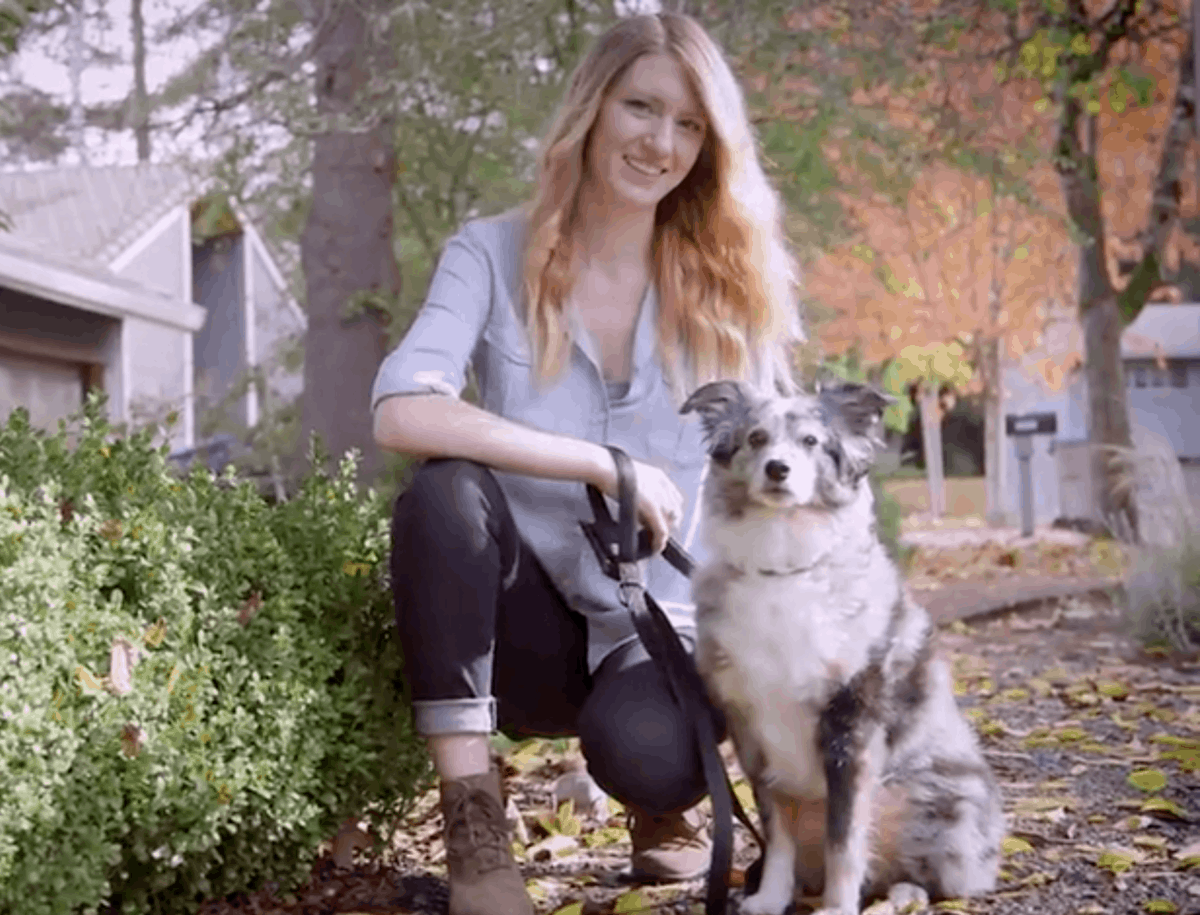 Koda the dog with her owner Stefani on a sidewalk